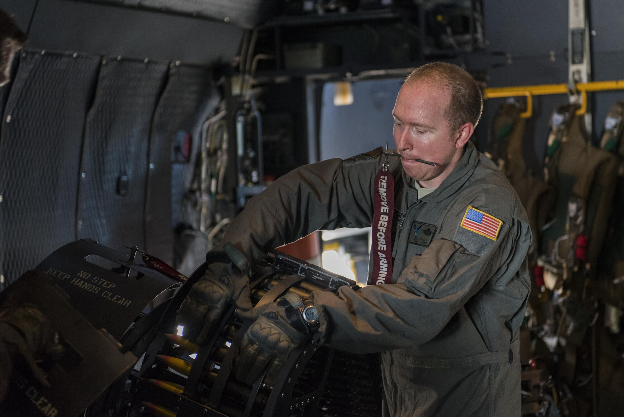 Tech. Sgt. William Sell 551st Special Operations Squadron aerial gunner evaluator, loads 30mm rounds into the gun aboard an AC-130W Stinger II gunship at Cannon Air Force Base, New Mexico, June 13, 2017. The two main guns on the gunship are the 30mm and the 105mm, with the 105 having to be loaded by hand after every shot. (U.S. Air Force photo by Staff Sgt. Michael Washburn/Released)