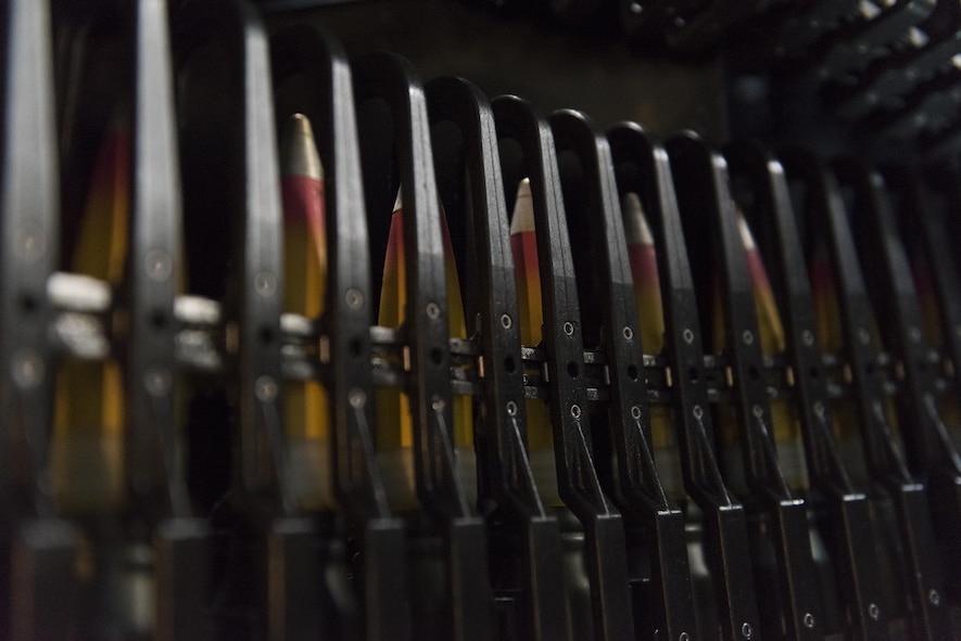 Rounds sit in the feeding system of the 30mm gun aboard an AC-130W Stinger II at Cannon Air Force Base, New Mexico, June 13, 2017. The crew on the AC-130W, which included instructors as well as students, were practicing live-fire training at Melrose Air Force Range, approximately 45 minutes away from the base. (U.S. Air Force photo by Staff Sgt. Michael Washburn/Released)