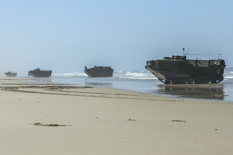 Assault Amphibious Vehicles, with 15th Marine Expeditionary Unit, lined up in formation on Red Beach during the Marine Air- Ground Task Force demonstration for the 75th Anniversary on Camp Pendleton, Calif., June 14, 2017. The demonstration allowed civilians to observe Marines as they recertified their qualifications before deployment. (U. S. Marine Corps photo by Lance Cpl. Betzabeth Y. Galvan)