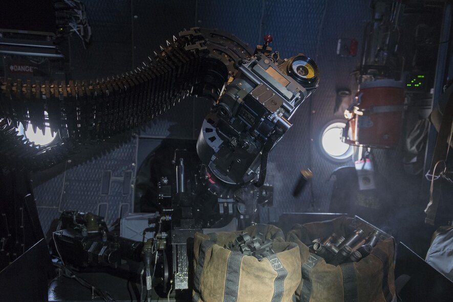 A bullet casing ejects from a 30mm gun aboard an AC-130W Stinger II at Cannon Air Force Base, New Mexico, June 13, 2017. The bullets in the 30mm gun are all linked together and are separated after being ejected from the weapon. (U.S. Air Force photo by Staff Sgt. Michael Washburn/Released)