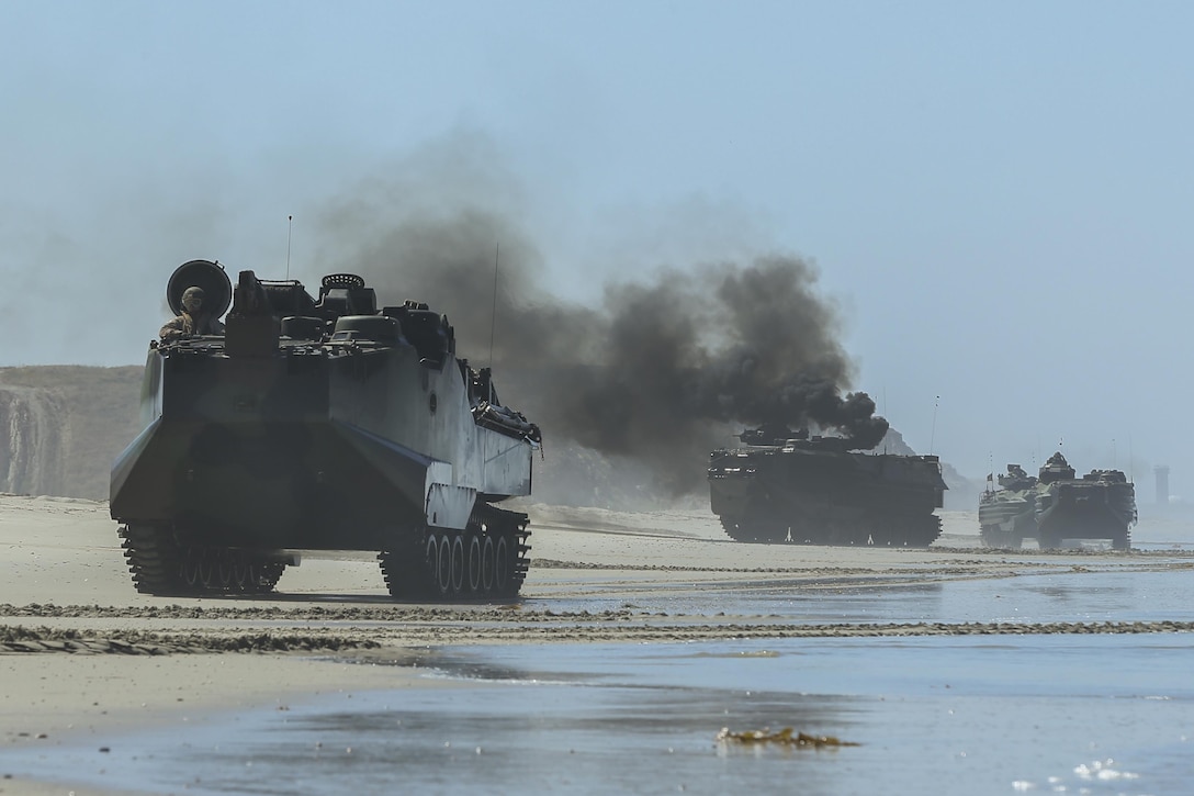 An Assault Amphibious Vehicle, with 15th Marine Expeditionary Unit, departs from Red Beach during the Marine Air- Ground Task Force demonstration for the 75th Anniversary on Camp Pendleton, Calif., June 14, 2017. The demonstration allowed civilians to observe Marines as they recertified their qualifications before deployment. (U. S. Marine Corps photo by Lance Cpl. Betzabeth Y. Galvan)