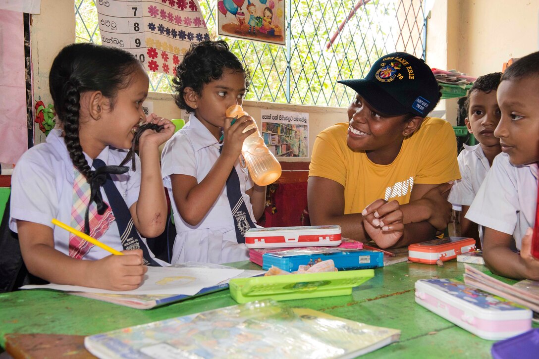 Navy Lt. Jg. Samara Griffin interacts with students at the Kalutara-Molkawa School near Kalutara, Sri Lanka, June 15, 2017, during a community engagement event in support of humanitarian assistance operations in the wake of severe flooding and landslides that devastated many regions of the country. Navy photo by Petty Officer 2nd Class Joshua Fulton