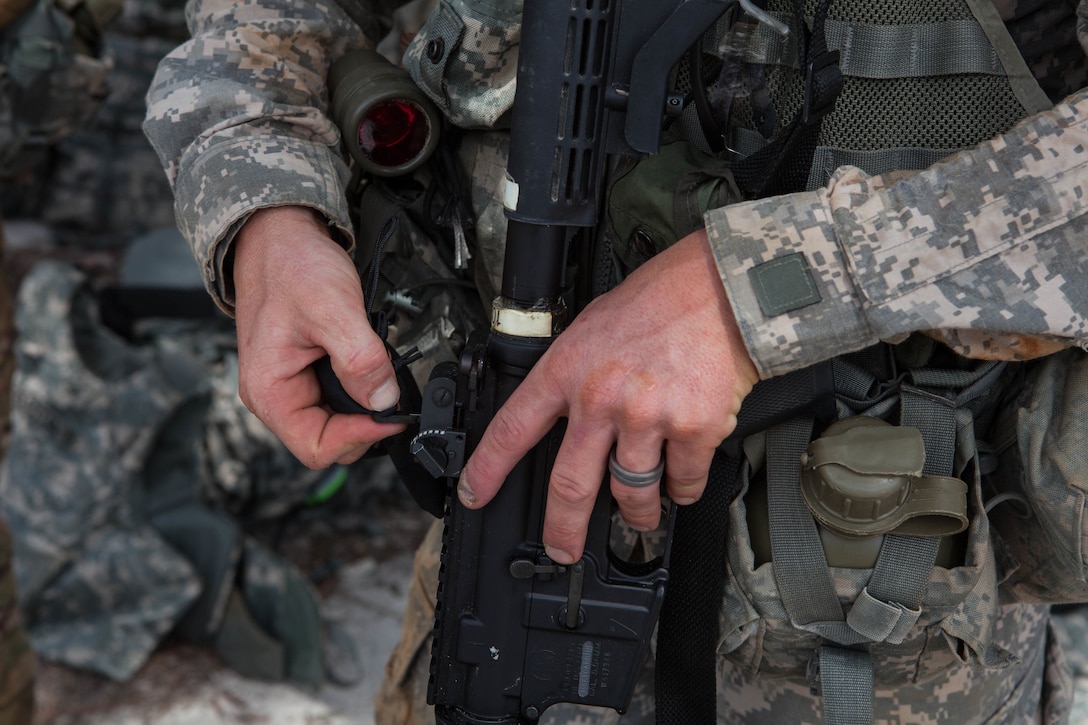 Sgt. 1st Class Andrew England, with the 402nd Engineer Company (Sapper), changes his rear sight aperture before zeroing his M4 rifle, at the 2017 U.S. Army Reserve Best Warrior Competition at Fort Bragg, N.C., June 13. This year's Best Warrior Competition will determine the top noncommissioned officer and junior enlisted Soldier who will represent the U.S. Army Reserve in the Department of the Army Best Warrior Competition later this year at Fort A.P. Hill, Va. (U.S. Army Reserve photo by Lisa Velazco) (Released)