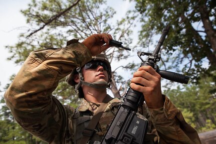 Sgt. Michael Hughes, with the 2nd Battalion, 377th Infantry Regiment, 95th Division, 108th Training Command, fixes his front sight post before zeroing his M4 rifle, at the 2017 U.S. Army Reserve Best Warrior Competition at Fort Bragg, N.C., June 13. This year's Best Warrior Competition will determine the top noncommissioned officer and junior enlisted Soldier who will represent the U.S. Army Reserve in the Department of the Army Best Warrior Competition later this year at Fort A.P. Hill, Va. (U.S. Army Reserve photo by Lisa Velazco) (Released)