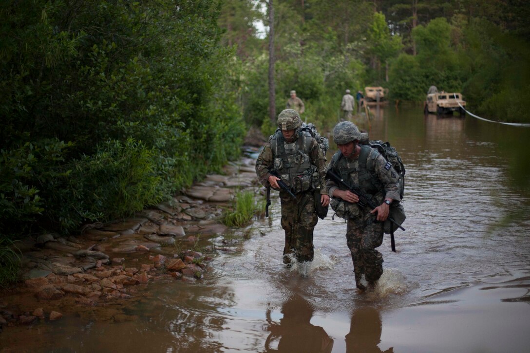 Spc. Wantae Seong a Carpentry & Mason representing 412th Theater Engineer Command along with (Need Other Soldier name) competes in Foot March, at the 2017 U.S. Army Reserve Best Warrior Competition at Fort Bragg, N.C., June 13. This year's Best Warrior Competition will determine the top noncommissioned officer and junior enlisted Soldier who will represent the U.S. Army Reserve in the Department of the Army Best Warrior Competition later this year at Fort A.P. Hill, Va. (U.S. Army Reserve photo by Spc. Jesse L. Artis Jr.) (Released)