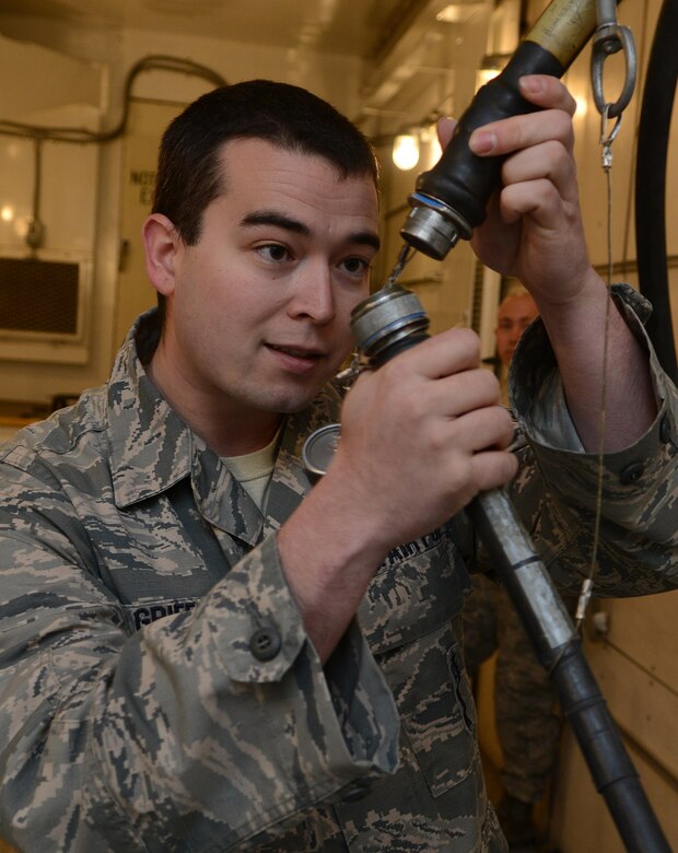 TSgt. Andrew Griffith, 91st Missile Maintenance Squadron Global Strike Challenge team chief, inspects a cable at Minot Air Force Base, N.D., May 30, 2017. To prepare for GSC 17 competition, the MMT performed payload transporter maintenance and inspections. (U.S. Air Force photo/Airman 1st Class Jonathan McElderry)