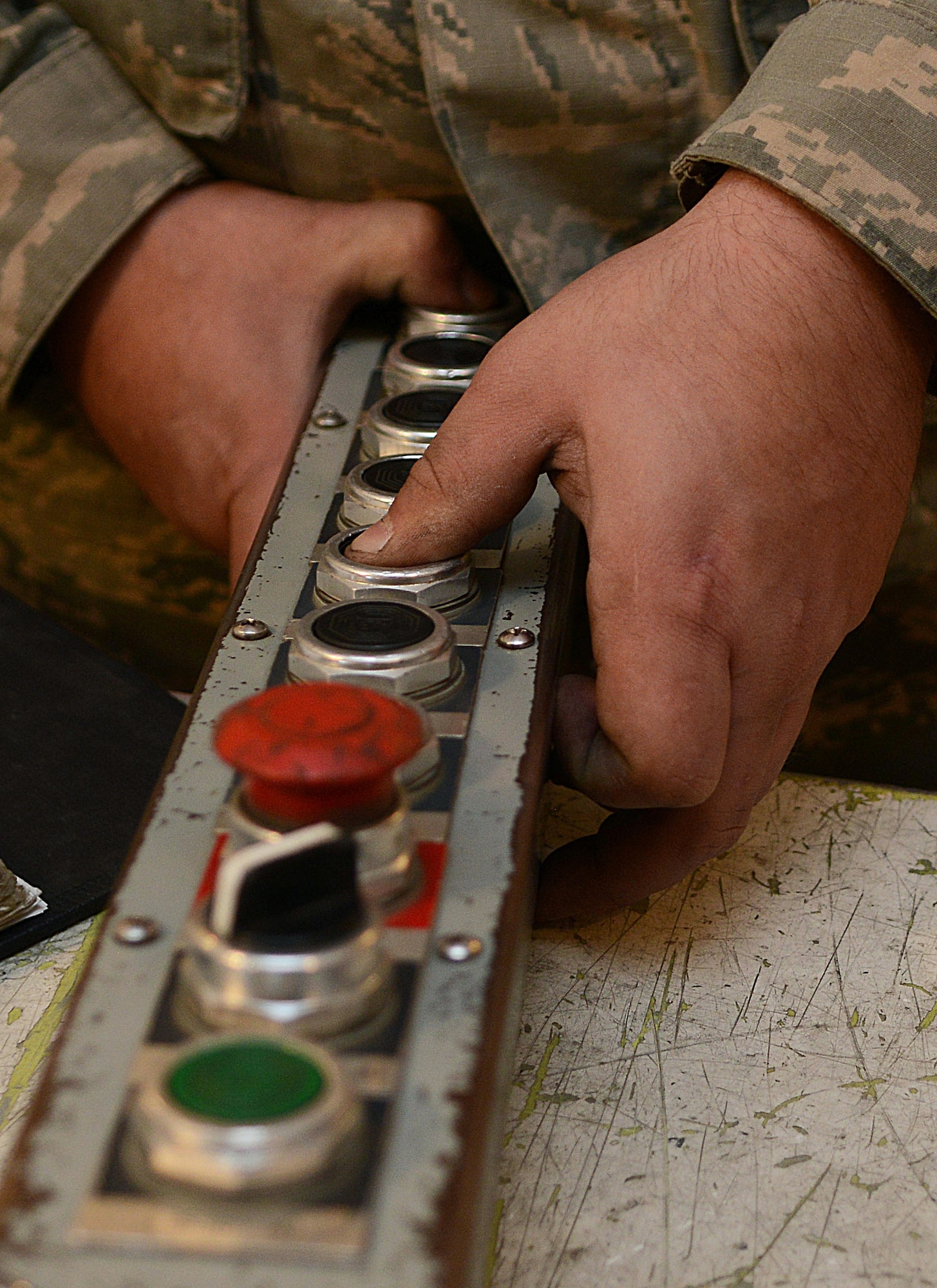 A member of the 91st Missile Maintenance Squadron missile maintenance team tests a hoist pendant at Minot Air Force Base, N.D., May 30, 2017. To prepare for Global Strike Challenge 2017, the five-member maintenance team inspected and tested various components of a payload transporter. (U.S. Air Force photo/Airman 1st Class Jonathan McElderry)