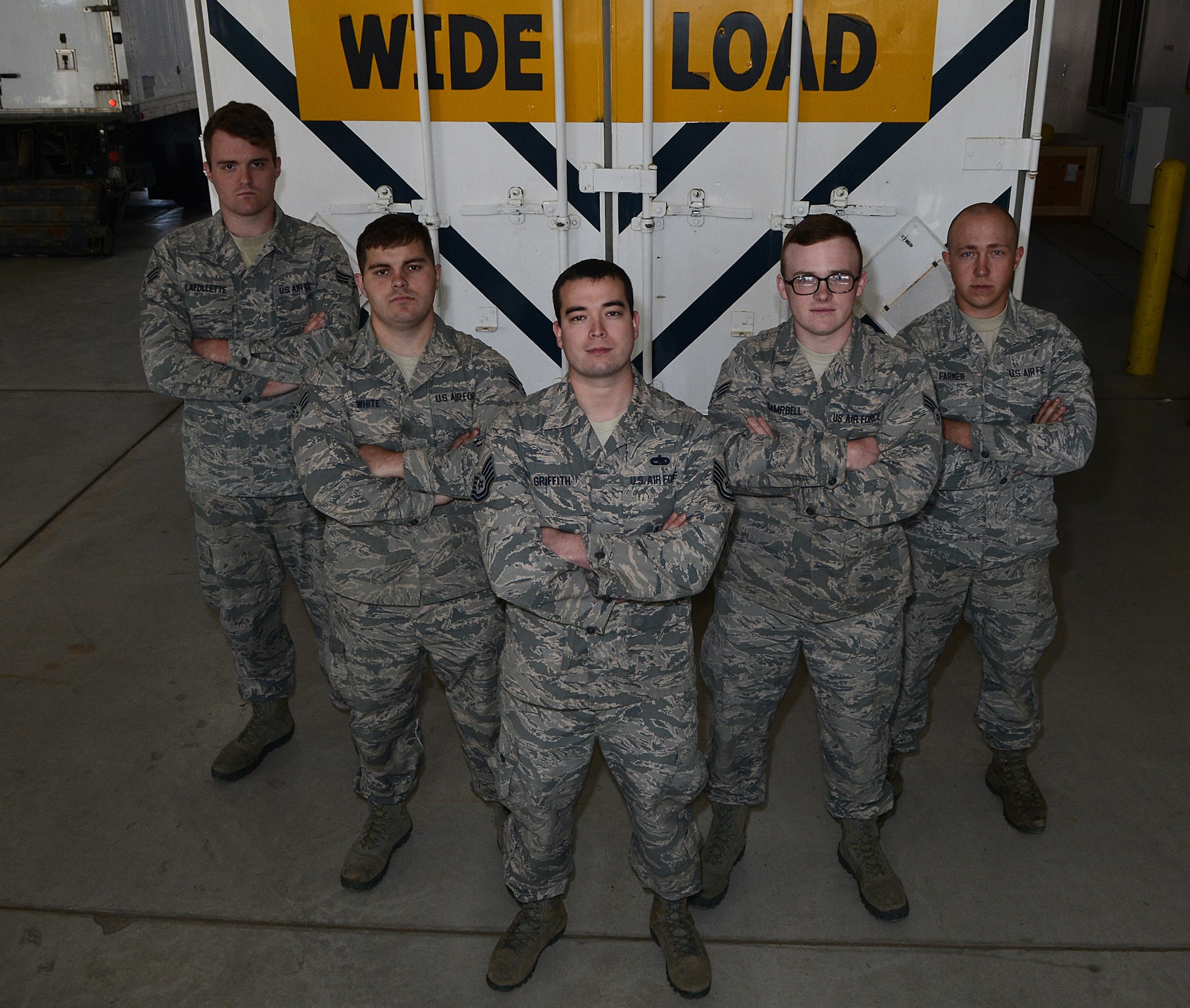 The 91st Missile Maintenance Squadron Global Strike Challenge missile maintenance team stands in front of a payload transporter at Minot Air Force Base, N.D., May 30, 2017. The MMT performed payload transporter maintenance and inspections to help them prepare for GSC 17. (U.S. Air Force photo/Airman 1st Class Jonathan McElderry)