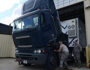 Members of the 91st Missile Maintenance Squadron missile maintenance team inspect a payload transporter at Minot Air Force Base, N.D., May 30, 2017. Global Strike Challenge MMT members check a vehicle’s engine, break fluids, fuel-water separators and several other components during each inspection. (U.S. Air Force photo/Airman 1st Class Jonathan McElderry)