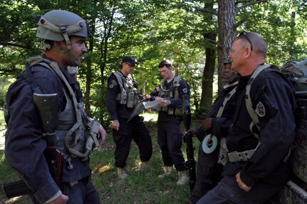 U.S. Soldiers from the 870th Engineer Company, 83rd Troop Command, Florida National Guard, plan routes and tactical positions while participating in exercise Combined Resolve VIII at Joint Multinational Readiness Center, Hohenfels, Germany June 9, 2017. Army National Guard Soldiers are serving as opposing forces in the exercise, which is designed to train the Army's Regionally Allocated Forces to the U.S. European Command. More than 3,400 participants from 10 nations are involved. 