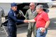 Thunderbird 8 Capt. Erik Gonsalves, the advance pilot and narrator for the U.S. Air Force Thunderbirds, greets Warren Schultz from David Schultz Airshows, LLC, and Lt. Col. Jeff Shaffer, Thunder Over the Valley Air Show director, June 14, 2017, after arriving at YARS. Gonsalves performed an aerial survey of YARS and the surrounding area before landing. The U.S. Air Force Thunderbirds demonstration team is scheduled to perform at Thunder Over the Valley Air Show, June 17-18. (U.S. Air Force photo/Senior Airman Joshua Kincaid)