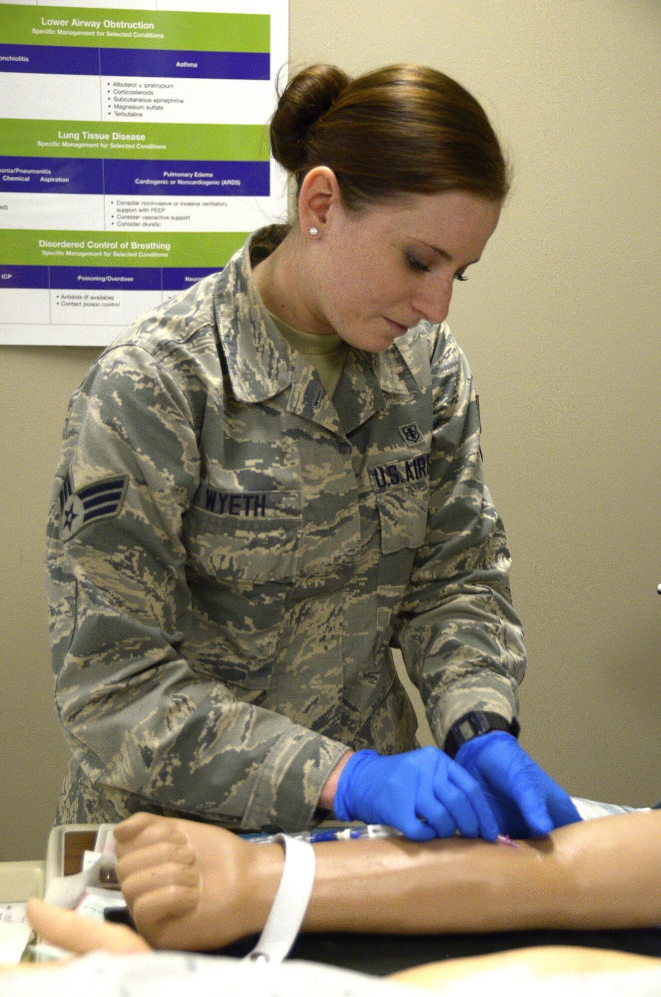 Senior Airman Erica Wyeth, an aerospace medical technician with the 445th Aerospace Medicine Squadron, practices placing an Intravenous (IV) needle into a patients arm, May 7, 2017 at the Wright-Patterson Air Force Base Medical Center. Wyeth is currently attending the University of Kentucky and showed to be very proficient at completing the task. (U.S. Air Force photo/Staff Sgt. Joel McCullough)