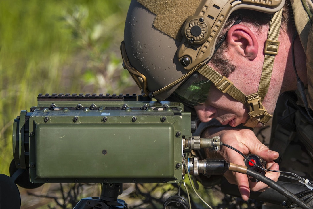 Air Force Staff Sgt. Brandon Cook marks targets with a laser marker system at Eielson Air Base, Alaska, June 13, 2017, during Red Flag-Alaska 17-2, an exercise focused on improving ground, space and cyberspace combat readiness and interoperability for U.S. and international forces. Cook is tactical air control party member assigned to the 116th Air Support Operations Squadron. Air Force photo by Staff Sgt Douglas Ellis