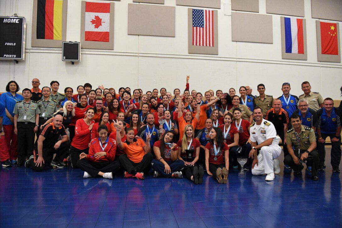 Teams gather after the closing ceremony of the 18th Conseil International du Sport Militaire (CISM) World Women’s Volleyball Military Championship on 9 June 2017 at Naval Station Mayport, Florida.