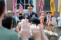 Maj. Gen. Troy D. Kok, commanding general of the U.S. Army Reserve’s 99th Regional Support Command, gives the oath of enlistment June 14 to almost 50 new Army recruits during the Stripes and Stars Festival celebrating the U.S. Army 242nd birthday at Independence Hall in Philadelphia.