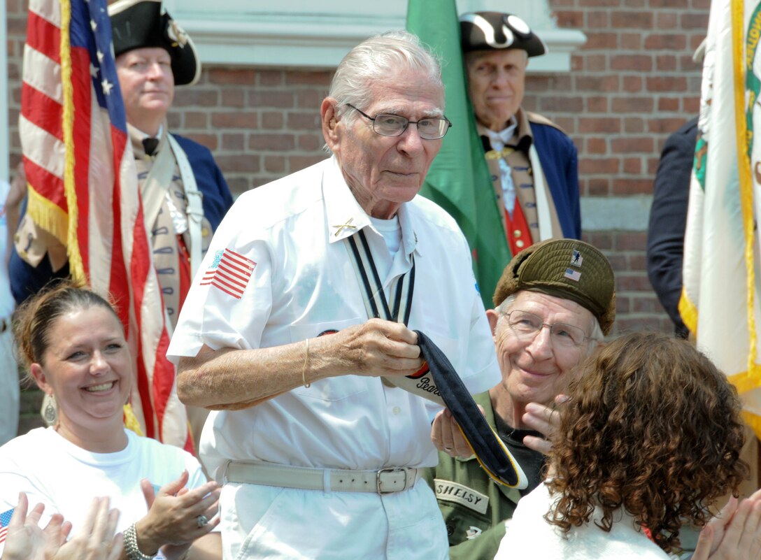 Pvt. Alex Horanczy, a Pearl Harbor Survivor who served with the 42nd Infantry Division during World War II, is honored June 14 during the Stripes and Stars Festival celebrating the U.S. Army 242nd birthday at Independence Hall in Philadelphia. Horanczy joined Maj. Gen. Troy D. Kok, commanding general of the U.S. Army Reserve’s 99th Regional Support Command, and retired Gen. Carter F. Ham, president and CEO of the Association of the United States Army and former commander of U.S. Africa Command, in cutting the Army birthday cake during the event.