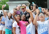 Maj. Gen. Troy D. Kok, commanding general of the U.S. Army Reserve’s 99th Regional Support Command (right), stops for “selfies” with schoolchildren visiting Independence Hall in Philadelphia June 14. Kok participated earlier that day in the Stripes and Stars Festival celebrating the U.S. Army 242nd birthday and was joined by retired Gen. Carter F. Ham, president and CEO of the Association of the United States Army and former commander of U.S. Africa Command.