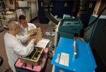 (From left) Staff Sgt. Dustin Stetler and Tech. Sgt. Maxie Cardinal, 791st Maintenance Squadron electronics laboratory technicians, reattach a top panel assembly at Minot Air Force Base, N.D., May 31, 2017. The ELAB team practiced maintenance on a circuitry test set in preparation for Global Strike Challenge 2017. (U.S. Air Force photo/Airman 1st Class Jonathan McElderry)