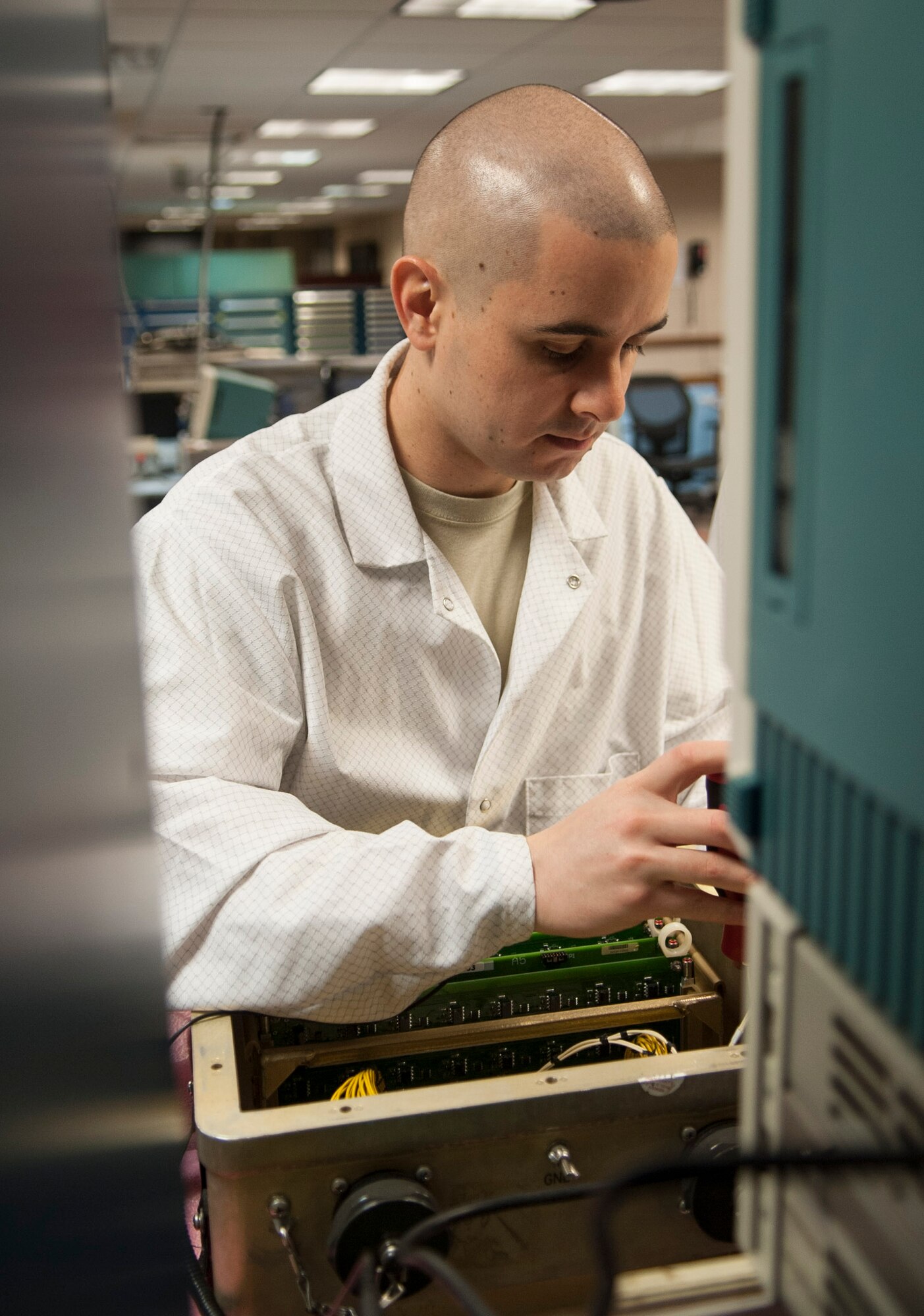 Staff Sgt. Dustin Stetler, 791st Maintenance Squadron electronics laboratory technician, removes a circuitry set at Minot Air Force Base, N.D., May 31, 2017. The ELAB team inspected, repaired and calibrated electronic components for launch facilities and launch control centers while training for Global Strike Challenge 2017. (U.S. Air Force photo/Airman 1st Class Jonathan McElderry)