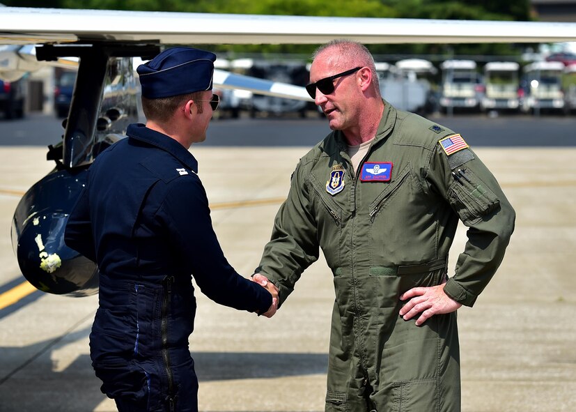 Thunderbird 8 Capt. Erik Gonsalves, the advance pilot and narrator for the U.S. Air Force Thunderbirds, greets Lt. Col. Jeff Shaffer, Thunder Over the Valley Air Show director, June 14, 2017, after arriving at YARS. Gonsalves performed an aerial survey of YARS and the surrounding area before landing. The U.S. Air Force Thunderbirds demonstration team is scheduled to perform at Thunder Over the Valley Air Show, June 17-18. (U.S. Air Force photo/Senior Airman Joshua Kincaid)
