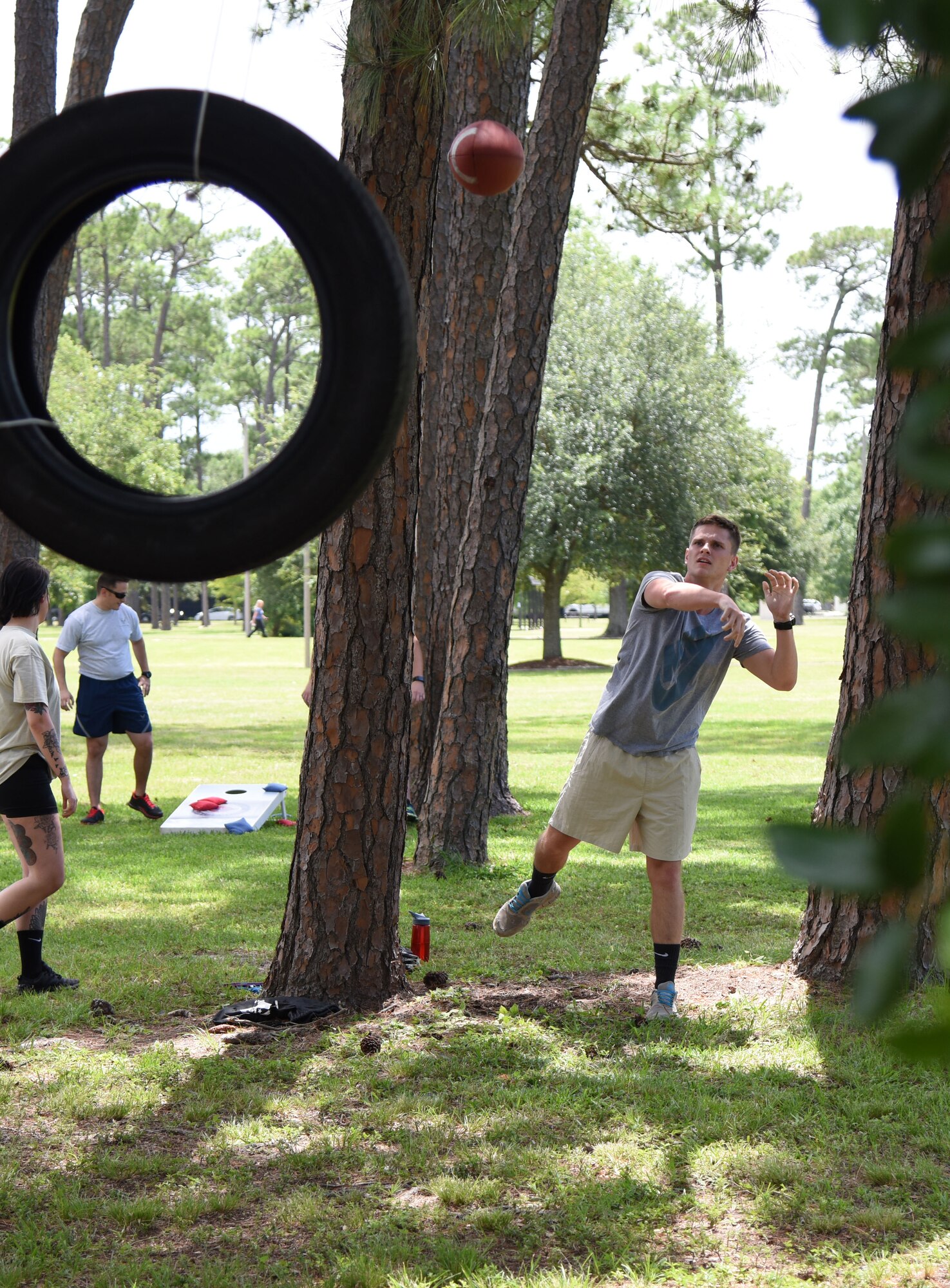 Airman 1st Class Justin Hearn, 81st Aerospace Medicine Squadron physical health technician, participates in a football skills competition behind the Blake Fitness Center June 13, 2017, on Keesler Air Force Base, Miss. The competition was one of several Wingman Week events focusing on resiliency and teambuilding initiatives across the base. (U.S. Air Force photo by Kemberly Groue)