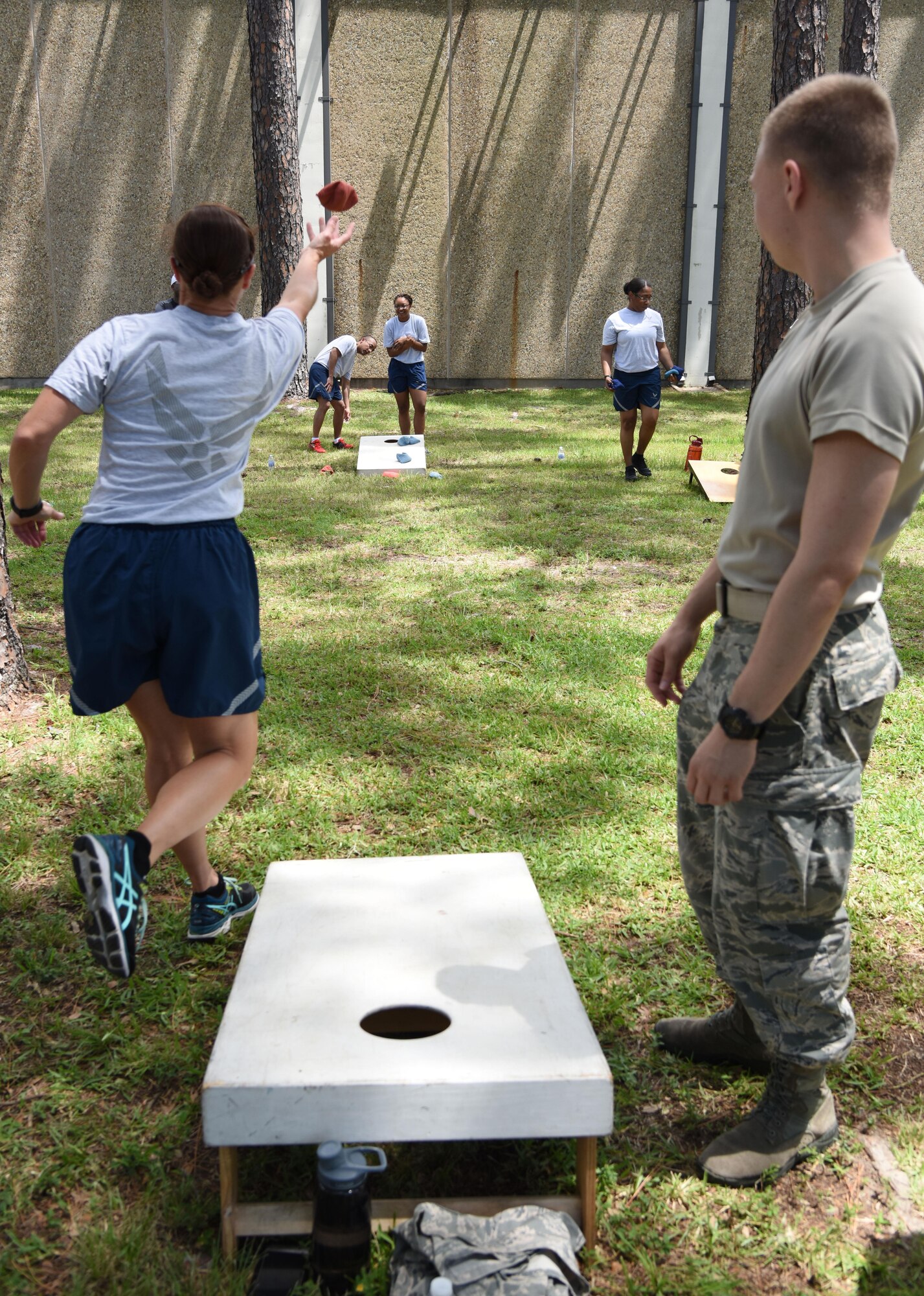 Keesler personnel participate in a cornhole competition behind the Blake Fitness Center June 13, 2017, on Keesler Air Force Base, Miss. The competition was one of several Wingman Week events focusing on resiliency and teambuilding initiatives across the base. (U.S. Air Force photo by Kemberly Groue)