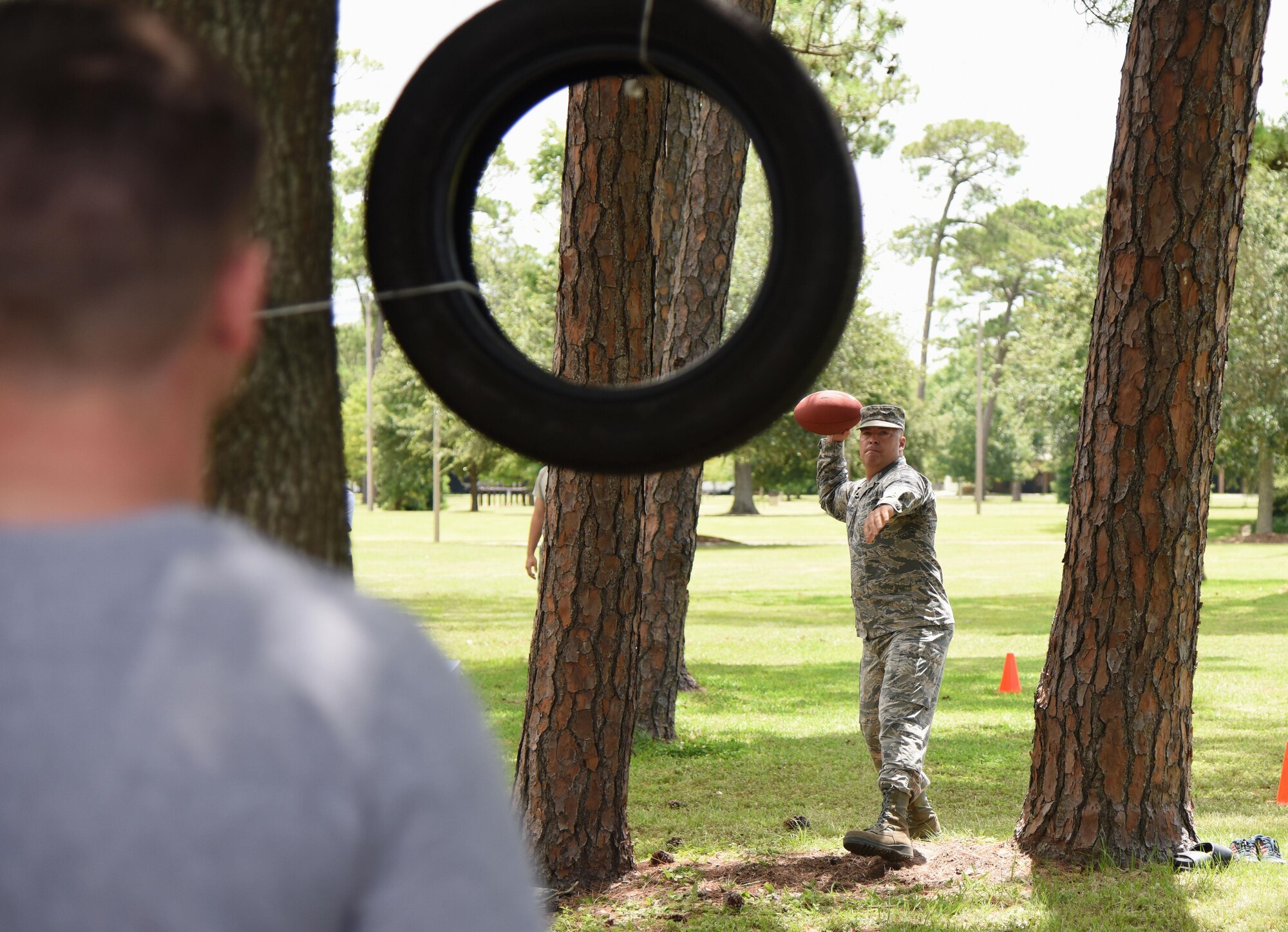 Chief Master Sgt. Derek Fromenthal, 338th Training Squadron superintendent, participates in a football skills competition behind the Blake Fitness Center June 13, 2017, on Keesler Air Force Base, Miss. The competition was one of several Wingman Week events focusing on resiliency and teambuilding initiatives across the base. (U.S. Air Force photo by Kemberly Groue)