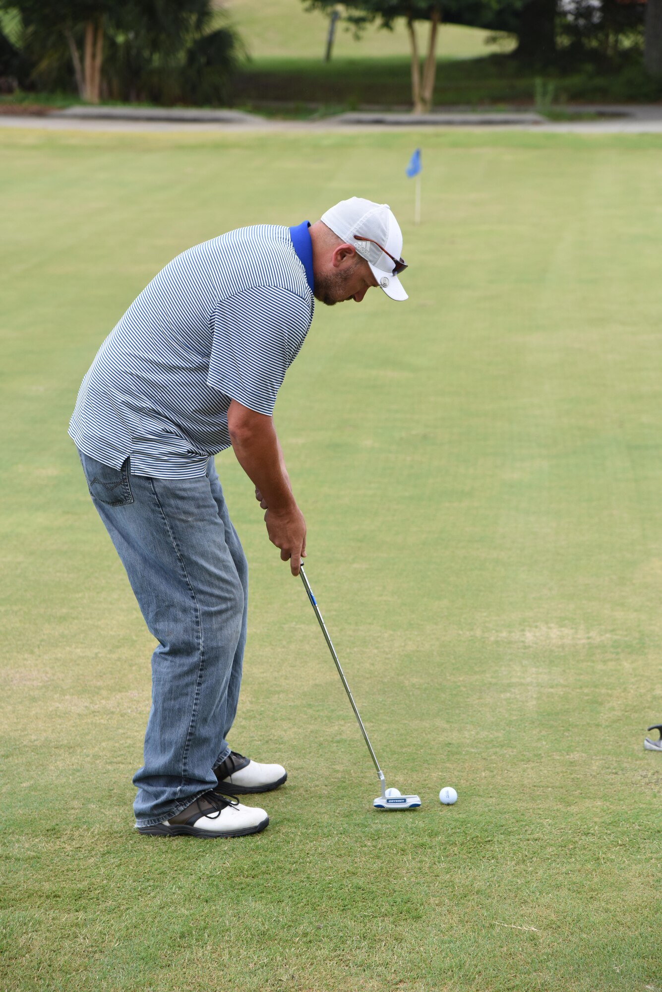 Heath Harris, 81st Training Support Squadron technical engineer, participates in a golf putting competition at the Bay Breeze Golf Course June 14, 2017, on Keesler Air Force Base, Miss. The competition was one of several Wingman Week events focusing on resiliency and teambuilding initiatives across the base. (U.S. Air Force photo by Kemberly Groue)