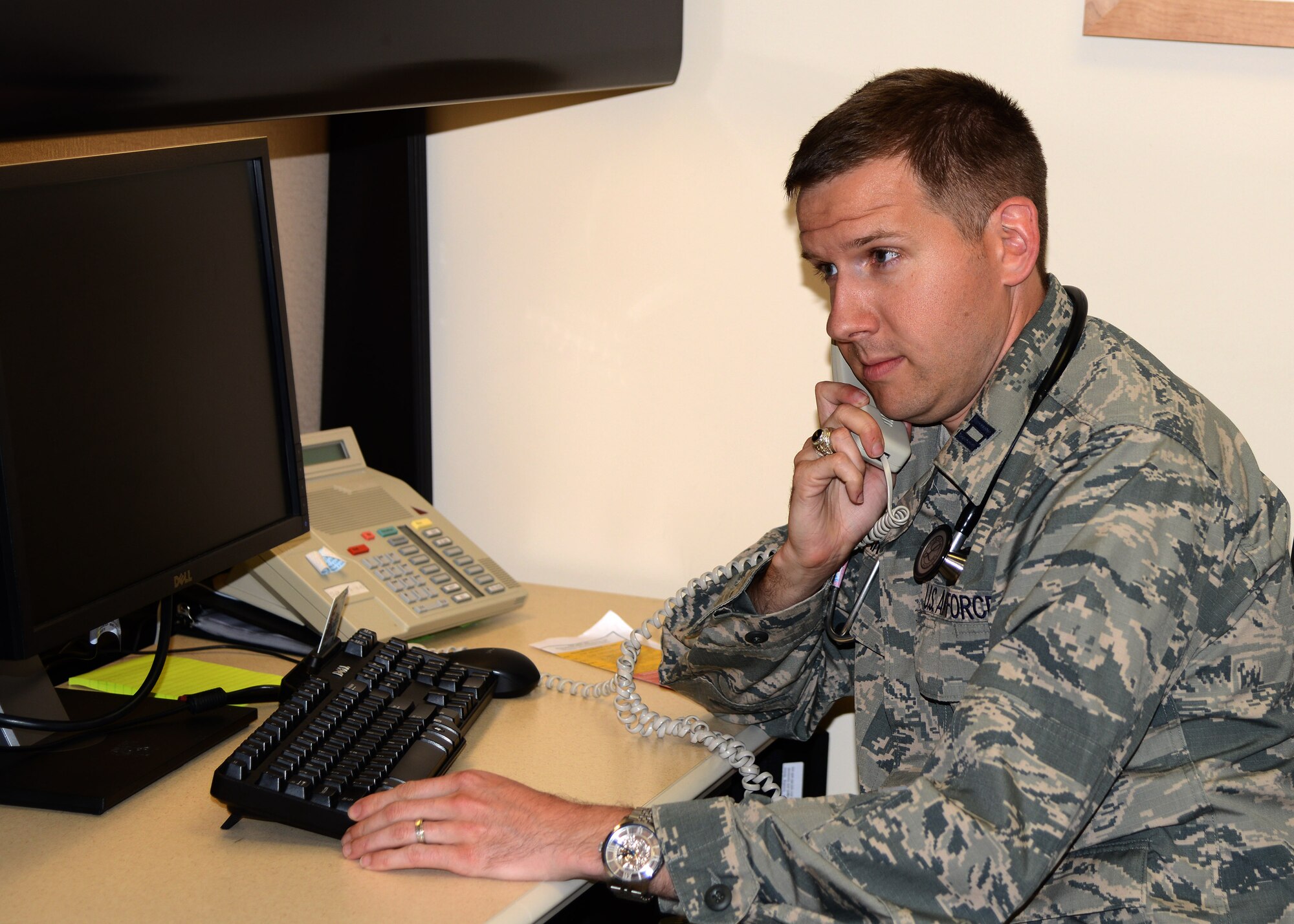 Capt. (Dr.) David Garcia, family medicine physician with the 412th Medical Group, demonstrates the virtual appointment capability by talking with a “test patient” while reviewing patient information on the medical database. The 412th MDG is the first in the Air Force to use virtual appointments. The 412th MDG is exploring further options in the virtual appointment realm, including video chat appointments. (U.S. Air Force photo by Christopher Ball)