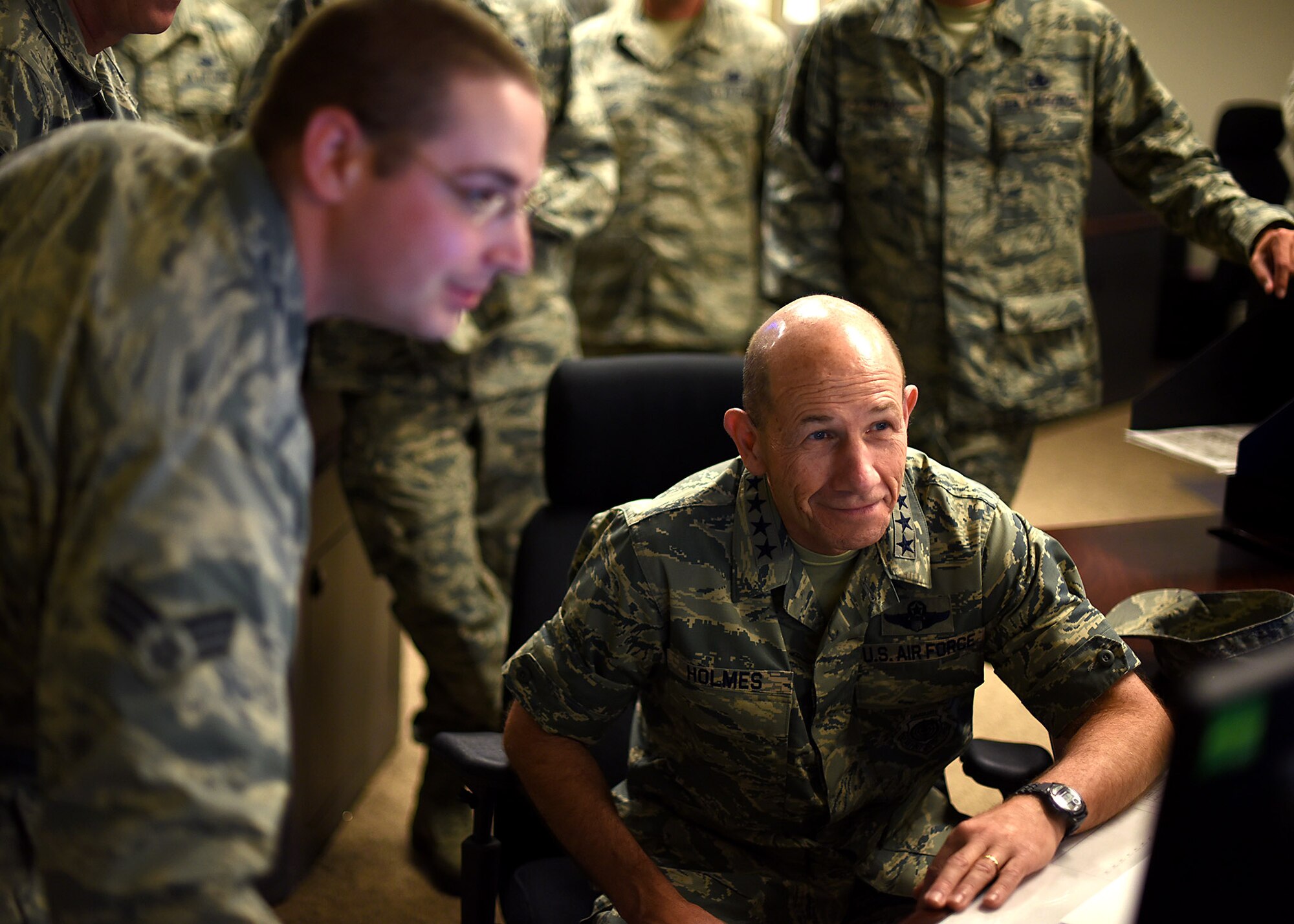 Gen. Mike Holmes, Air Combat Command commander, right, looks on as Senior Airman Nicholas Anthony, 319th Communications Squadron High Frequency Global Communication System radio operator, explains the capabilities of the HFGCS, June 15, 2017, on Grand Forks AFB, N.D. The HFGCS mission is a new asset to ACC and Holmes was able to get a look at how it works. (U.S. Air Force photo by Senior Airman Ryan Sparks)