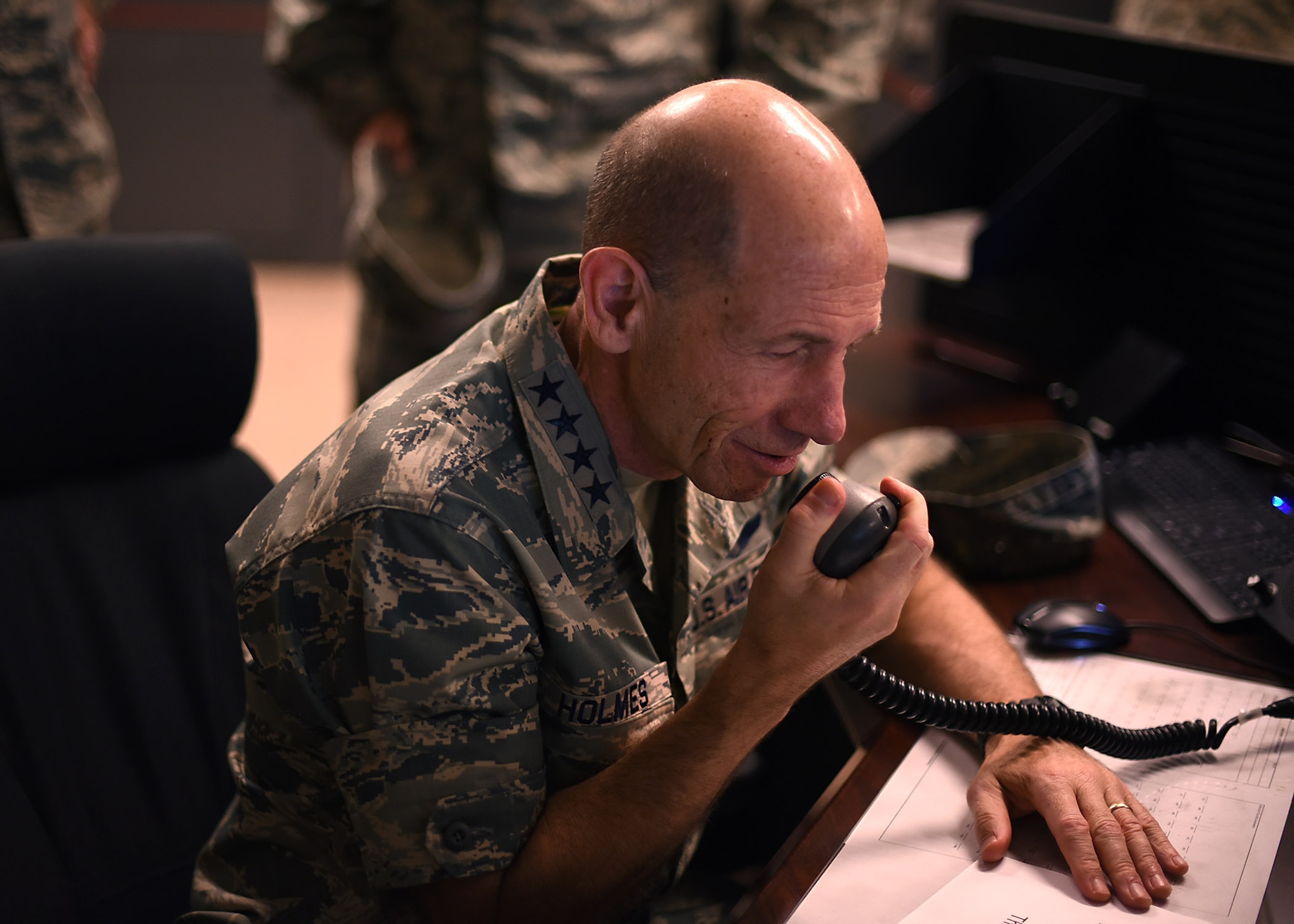 Gen. Mike Holmes, Air Combat Command commander, makes a test call using the High Frequency Global Communication System radio June 15, 2017, on Grand Forks AFB, N.D. Holmes was coined by the 319th Communications Squadron HFGCS unit for making his first official call which broadcasts his voice simultaneously across the world. (U.S. Air Force photo by Senior Airman Ryan Sparks)