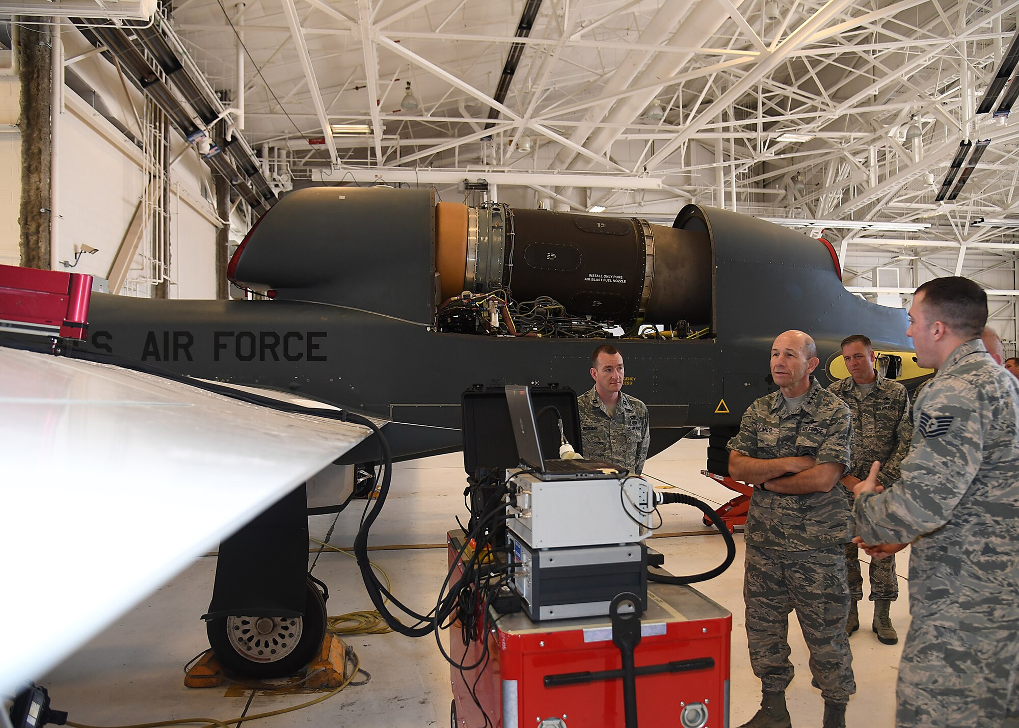 Gen. Mike Holmes, Air Combat Command commander, watches a Mobile Automated Scanner demonstration June 15, 2017, on Grand Forks AFB, N.D. Members of the 69th Maintenance Group were the first Airmen to complete this type of scan on the RQ-4 Global Hawk. (U.S. Air Force photo by Senior Airman Ryan Sparks)