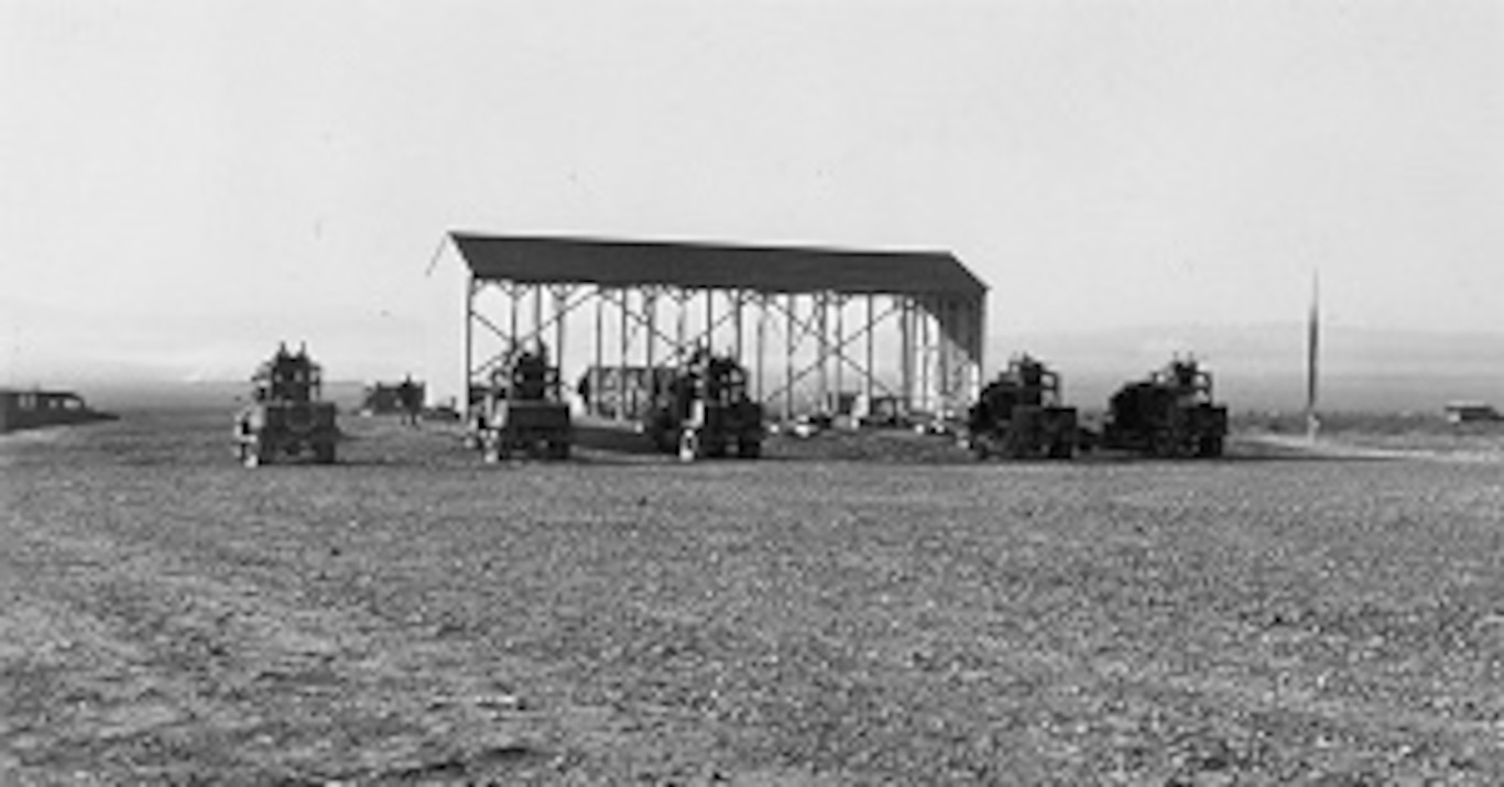 Gunnery students in Sperry upper turrets firing on the moving target range.