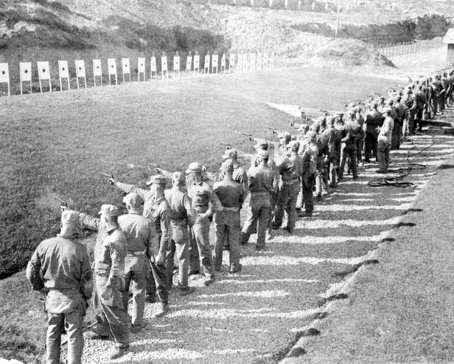 Recruits on the firing line at the .45 pistol range. Camp Matthews, October 1950.