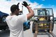 Senior Airman Jahn Mathis guides Senior Airman Gerardo Candelario-Ordunez (inside forklift), both 944th Logistics Readiness Squadron vehicle operators, as part of training on picking up and moving cargo June 7 at Aviano Air Base, Italy. The two are part of a 6-man vehicle operations team here for their annual tour, taking advantage of the opportunity to work and train with their active-duty counterparts. (U.S. Air Force photo by Tech. Sgt. Nestor Cruz)