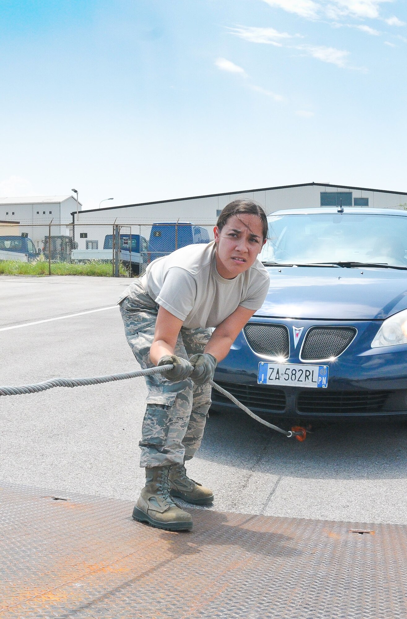 Senior Airman Ashley Arseo, 944th Logistics Readiness Squadron vehicle operator, secures a chain to the vehicle during vehicle recovery training June 7 at Aviano Air Base, Italy. Her 6-man vehicle operations team is here for their annual tour, taking advantage of the opportunity to work and train with their active-duty counterparts. (U.S. Air Force photo by Tech. Sgt. Nestor Cruz)