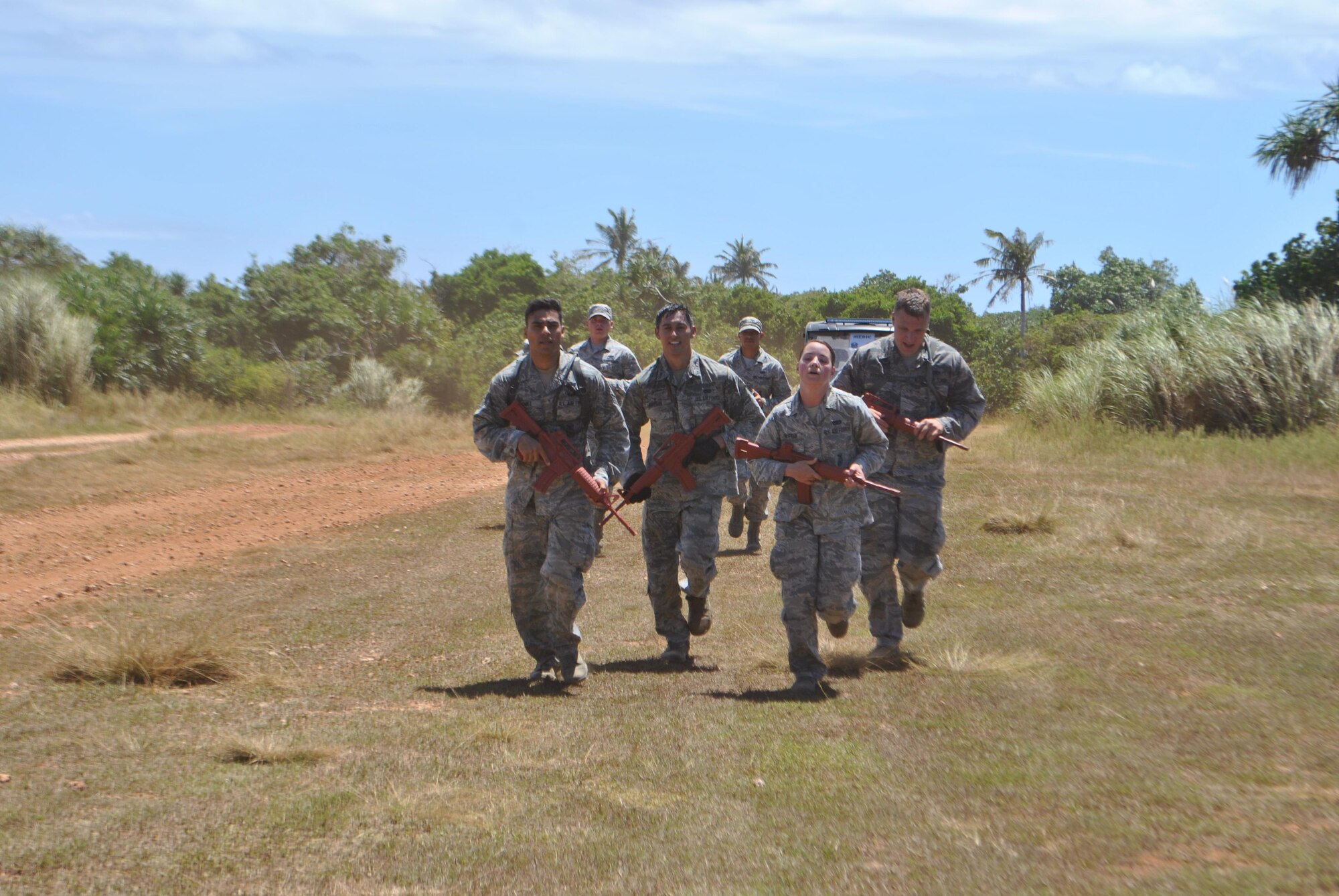 Yokota’s 374th Security Forces Squadron 2017 Security Forces Advanced Combat Skills Assessment team run with simulated weapons during the completion June 9, 2017, at Andersen Air Force Base, Guam. Yokota’s team won first place in the Mental and Physical Challenge out of the 11 Pacific Air Force bases to compete. (Curtesy photo by Capt. Kevin D. Collett) 