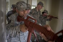 Staff Sgt. Oscar Gomez, 374th Security Forces Squadron NCO in charge of plans and programs, leads a team during close quarters combat training May 15, 2017, at Yokota Air Base, Japan. The 374 SFS team regularly trained in tactical procedures such as clearing buildings of civilians and hostiles for the 2017 Security Forces Advanced Combat Skills Assessment competition at Andersen Air Force Base, Guam. (U.S. Air Force photo by Airman 1st Class Donald Hudson)