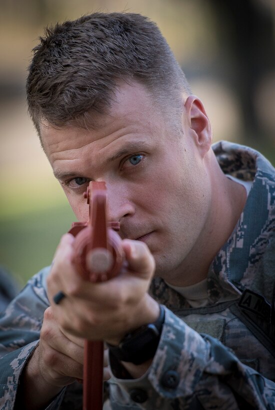 Tech. Sgt. Christopher Pfeiffer, 374th Security Forces Squadron Advanced Combat Skills Assessment team lead, looks down the sight of a training weapon during building clearing training, May 23, 2017, at Yokota Air Base, Japan.  The 374 SFS team regularly trained in tactics of clearing buildings of civilians and hostels for the 2017 Security Forces Advanced Combat Skills Assessment competition at Andersen Air Force Base, Guam. (U.S. Air Force photo by Airman 1st Class Donald Hudson)