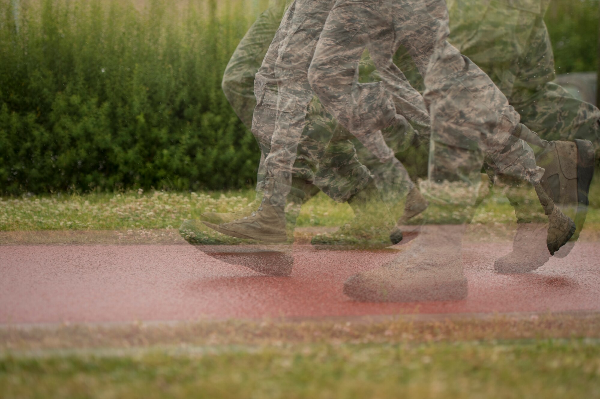 The 374th Security Forces Squadron Advanced Combat Skills Assessment team runs at Samurai Training Grounds while in full uniform during physical training, May 25, 2017, at Yokota Air Base, Japan. The 2017 Security Forces ACSA competition includes a physical training portion where the teams must complete the Combat Fitness Test as a team. (U.S. Air Force photo by Airman 1st Class Donald Hudson)