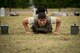 Senior Airman Francisco Daniel Barron, 374th Security Forces Squadron alarm monitor, performs a pushup during physical training, May 25, 2017, at Yokota Air Base, Japan. The 374 SFS team regularly trained in full uniform, running a mile and completing the core tasks of the Combat Fitness Test a total of four times in one physical training session in preparation for the 2017 Security Forces Advanced Combat Skills Assessment competition at Andersen Air Force Base, Guam. (U.S. Air Force photo by Airman 1st Class Donald Hudson)