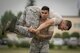 Staff Sgt. Oscar Gomez, 374th Security Forces Squadron non-commissioned officer in charge of plans and programs, fireman carries Tech. Sgt. Christopher Pfeiffer, 374 SFS Advanced Combat Skills Assessment team lead, during physical training, May 25, 2017, at Yokota Air Base, Japan. Gomez was part of the 2011 winning team of the Global Strike Challenge and won best firing team at the 2012 GSC; he acted as the 374 SFS team coach for the 2017 Security Forces Advanced Combat Skills Assessment completion. (U.S. Air Force photo by Airman 1st Class Donald Hudson)