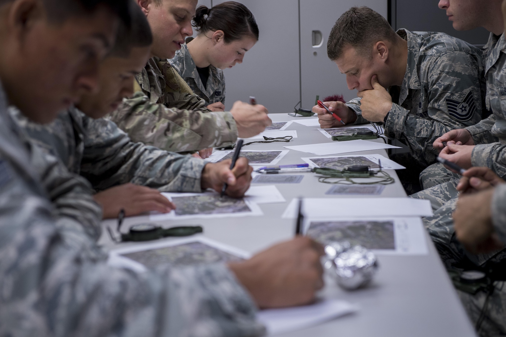 The 374th Security Forces Squadron 2017 Security Forces Advanced Combat Skills Assessment team practices land navigation during a Survival, Evasion, Resistance and Escape class, May 26, 2017, at Yokota Air Base, Japan. The 374 SFS team attended classes taught by experts in their respected fields and included topics such as Survival Evasion Resistance and Escape, night and day time land navigation, range estimation and weapons breakdown. (U.S. Air Force photo by Airman 1st Class Donald Hudson)