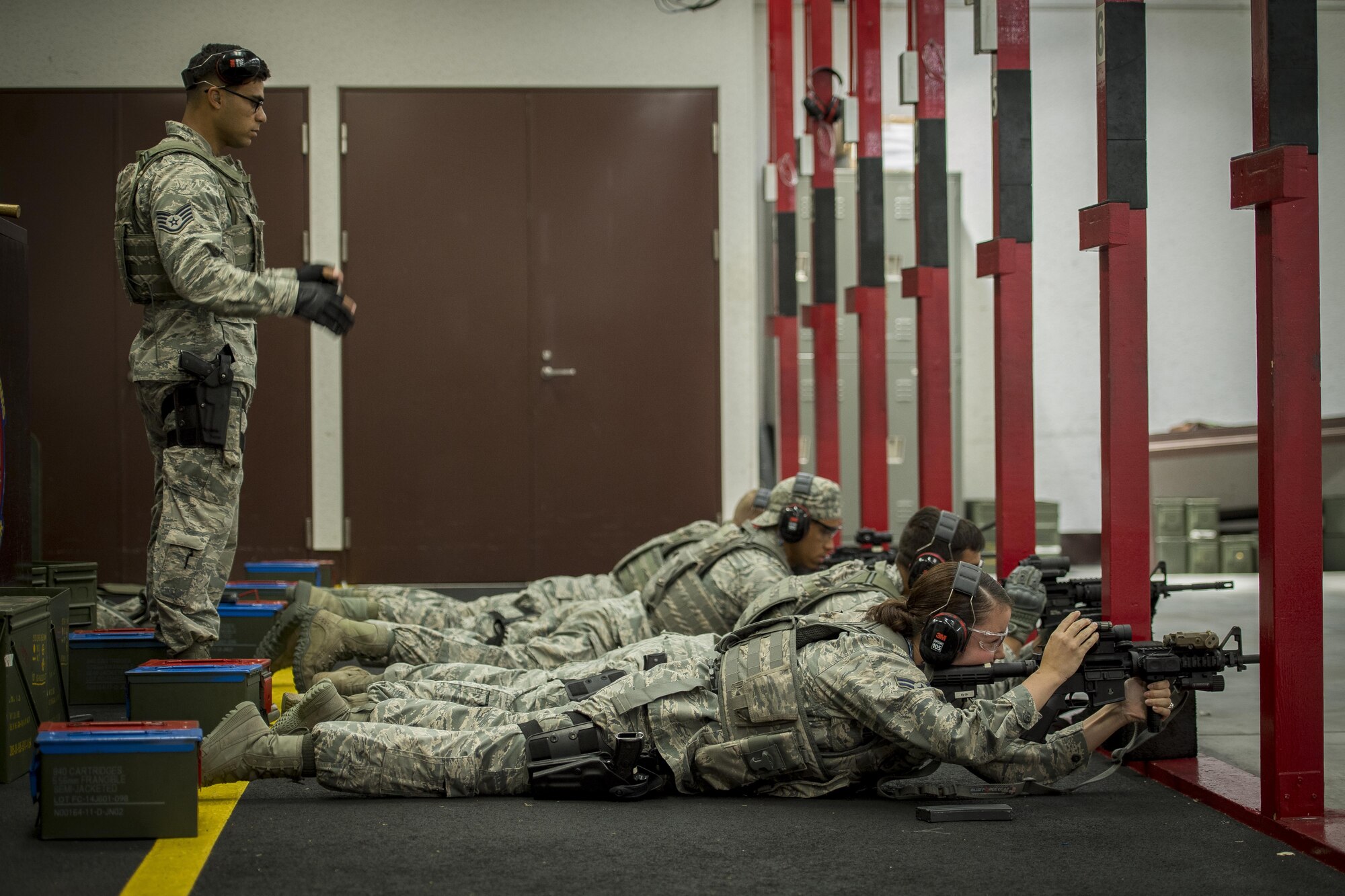 The 374th Security Forces Squadron 2017 Security Forces Advanced Combat Skills Assessment team practices tactical firing of the M4 carbine assault rifle, June 1, 2017, at Yokota Air Base, Japan. The 374 SFS team regularly practiced firing various weapons including the: M4 carbine assault rifle, M9 pistol, M249 light machine gun and the M203 grenade launcher in preparation for the Advanced Combat Skills Assessment competition at Andersen Air Force Base, Guam. (U.S. Air Force photo by Airman 1st Class Donald Hudson)
