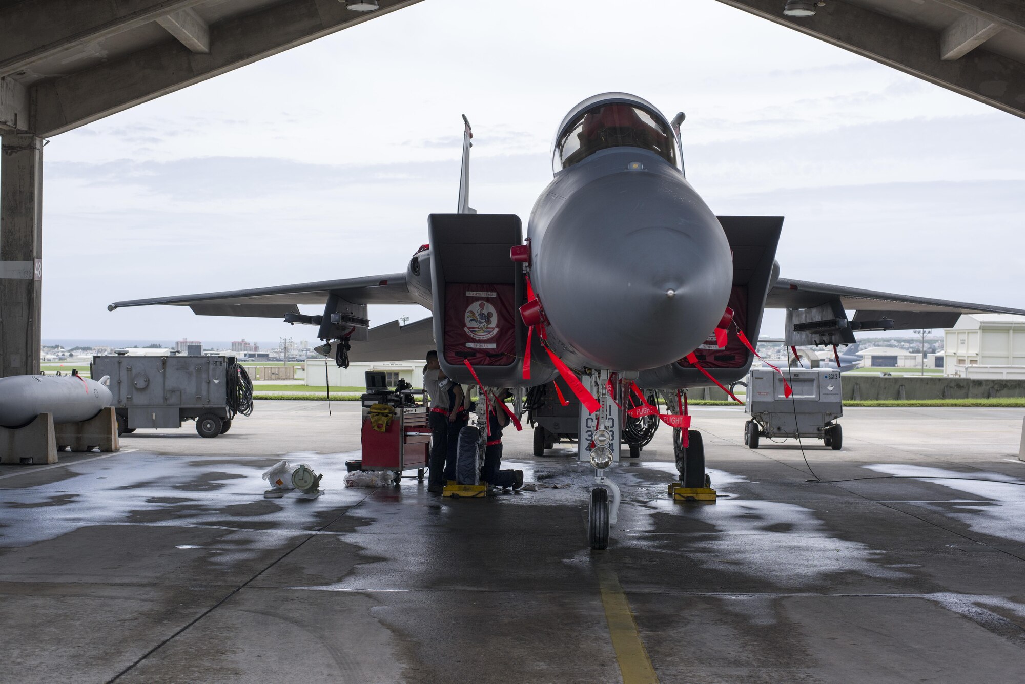 U.S. Air Force 67th Aircraft Maintenance Unit F-15 Eagle crew chiefs inspect hydraulic systems of an F-15 during training operations June 13, 2017, at Kadena Air Base, Japan. The 67th AMU helps maintain the aircraft of one of the largest fighter wing in the U.S. Air Force. (U.S. Air Force photo by Senior Airman Omari Bernard)