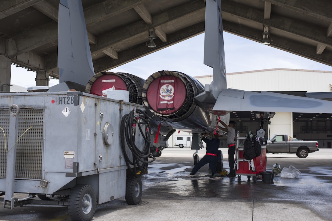 U.S. Air Force 67th Aircraft Maintenance Unit F-15 Eagle crew chiefs inspect hydraulic systems of an F-15 during training operations June 13, 2017, at Kadena Air Base, Japan. The 67th AMU helps maintain the aircraft of one of the largest fighter wing in the U.S. Air Force. (U.S. Air Force photo by Senior Airman Omari Bernard)
