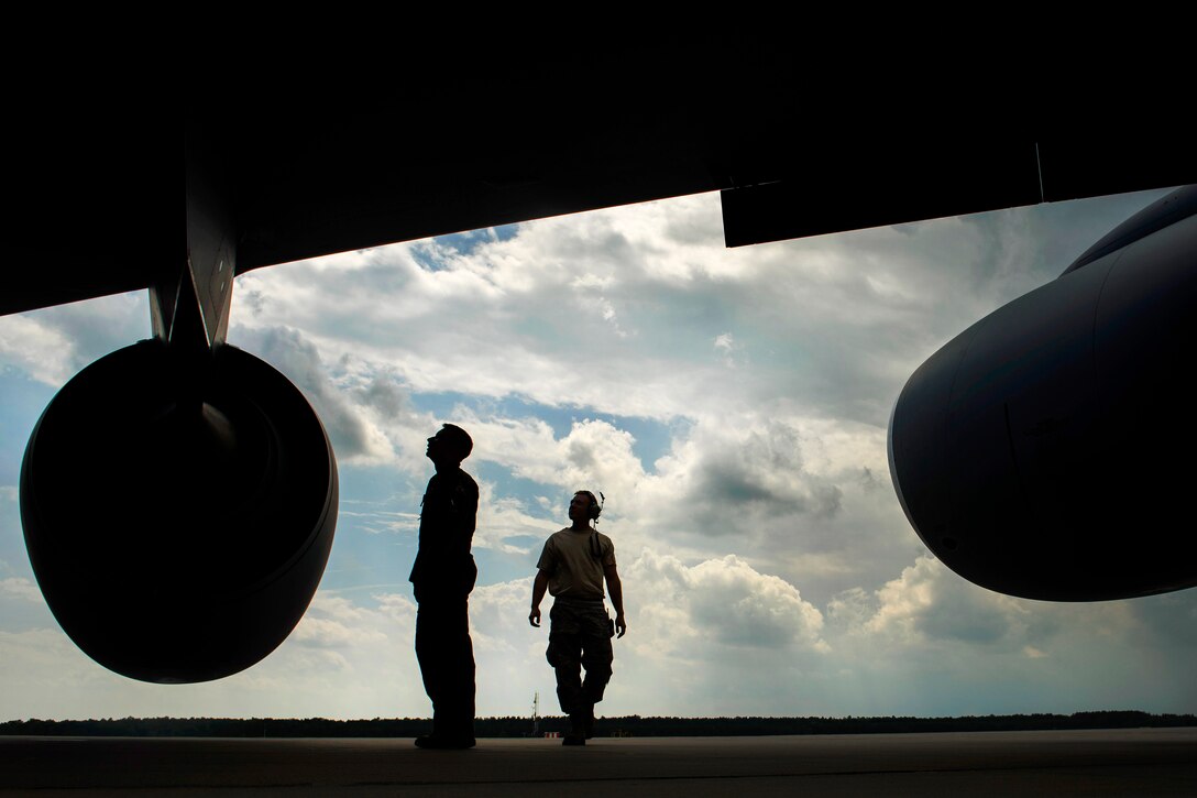 Air Force Capt. Cody Jordan, left, and Master Sgt. Jacob Wavrin 
performs pre-flight inspections on a KC-135R Stratotanker during Baltic Operations 2017 at Powidz Air Base, Poland, June 12, 2017. Jordan is a pilot assigned to the 351st Air Refueling Squadron. Wavrin is a crew chief assigned to the 459th Aircraft Maintenance Squadron. The exercise is designed to enhance flexibility and interoperability, and to strengthen combined response capabilities, as well as demonstrate resolve among allied and partner nations' forces to ensure stability in, and if necessary defend, the Baltic Sea region. Air Force photo by Staff Sgt. Jonathan Snyder