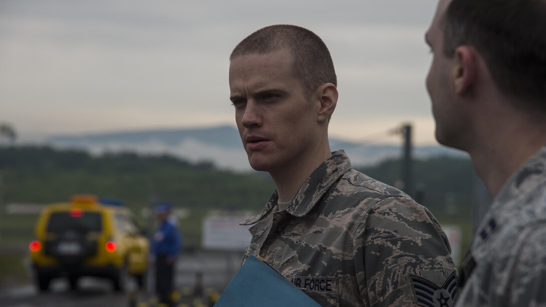 U.S. Air Force Staff Sgt. Brek Halgren, the 35th Medical Support Squadron aeromedical evacuation NCO in charge, waits for the arrival of a C-17 Globemaster III assigned to the 517th Airlift Squadron, Joint Base Elmendorf-Richardson, Alaska, for an evacuation in Aomori, Japan, June 15, 2017. Since the Misawa Air Base runway remains closed for construction, the 35th Medical Group relied on solidified friendships among the Japanese to help coordinate the evacuation at the Aomori Airport. (U.S. Air Force photo by Senior Airman Deana Heitzman)