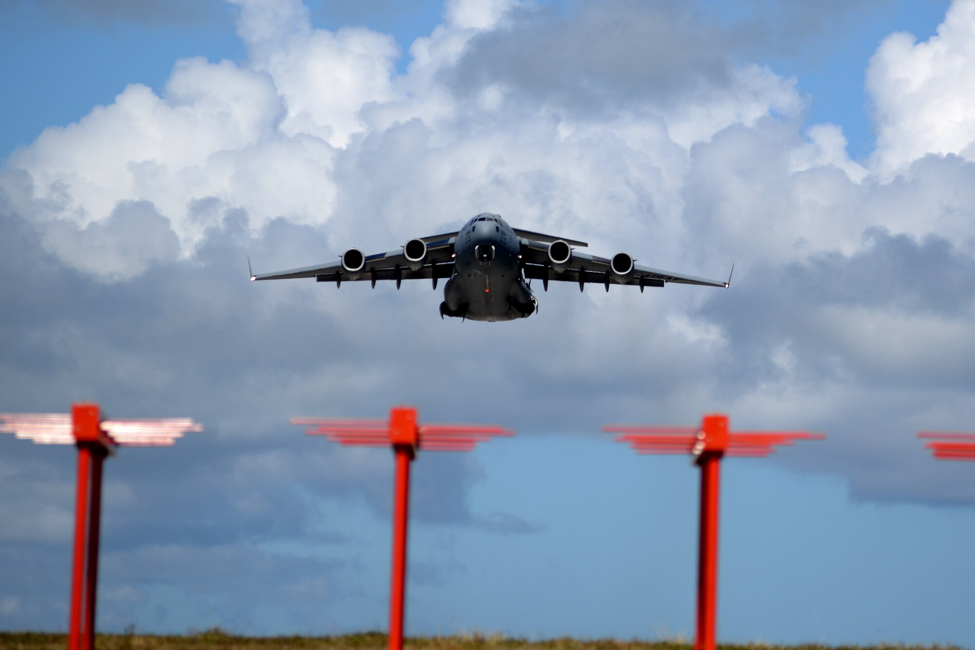 A U.S. Air Force C-17 Globemaster III aircraft assigned to Travis Air Force Base, Ca., takes off June 6, 2017, from Andersen Air Force Base, Guam. The 734th Air Mobility Squadron recently used the C-17s for a readiness exercise testing fall rescue procedures. (U.S. Air Force photo by Airman 1st Class Gerald R. Willis)