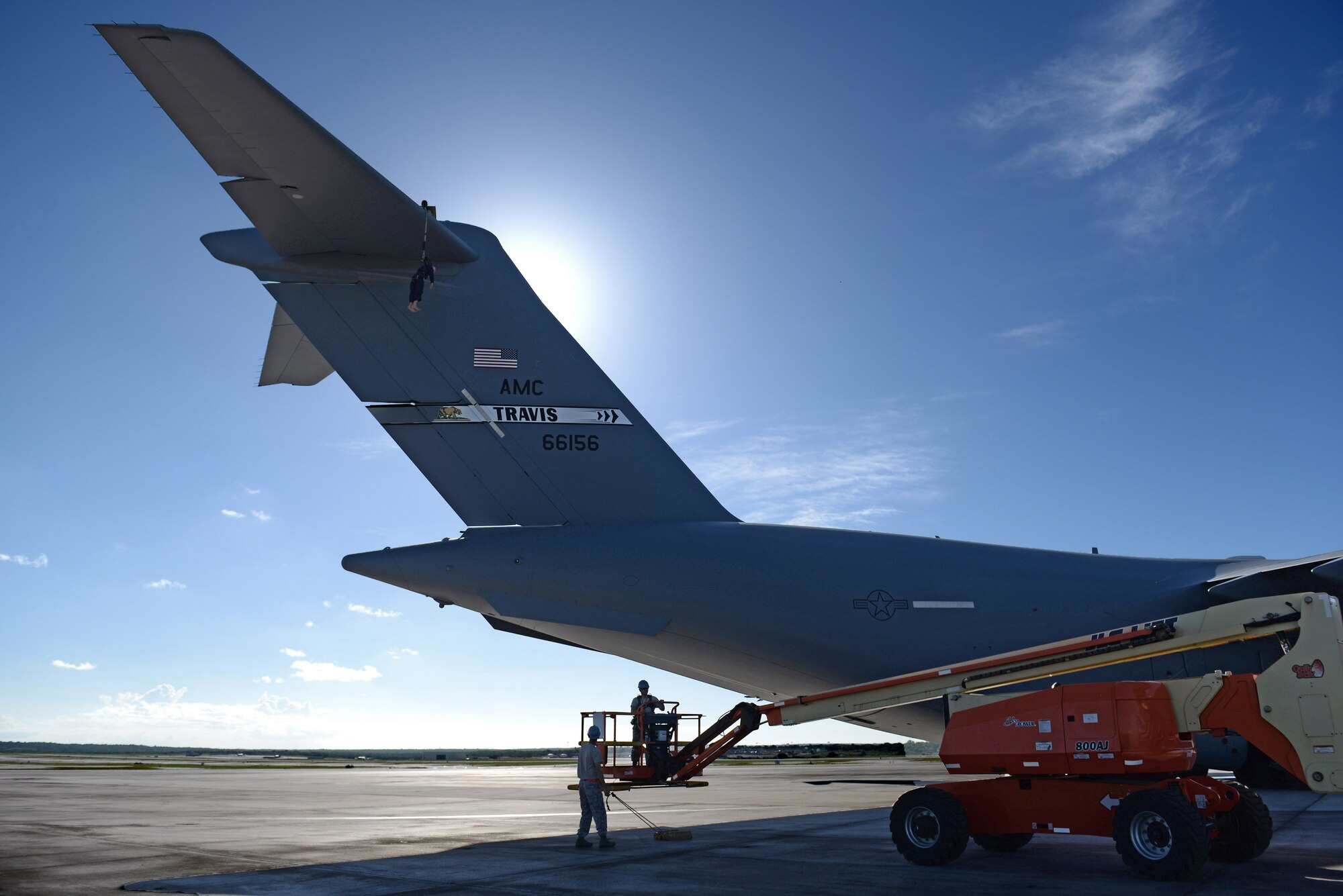 U.S. Air Force Tech Sgt. Brandon Crilly, 734th Air Mobility Squadron navigation and communication specialist, retrieves a dummy during a training exercise June 12, 2017, at Andersen Air Force Base, Guam. The exercise allowed the Airmen of the 734th AMS to practice their fall rescue procedures from the top of a C-17 Globemaster III tail 55 feet in the air. (U.S. Air Force photo by Airman 1st Class Gerald R. Willis)